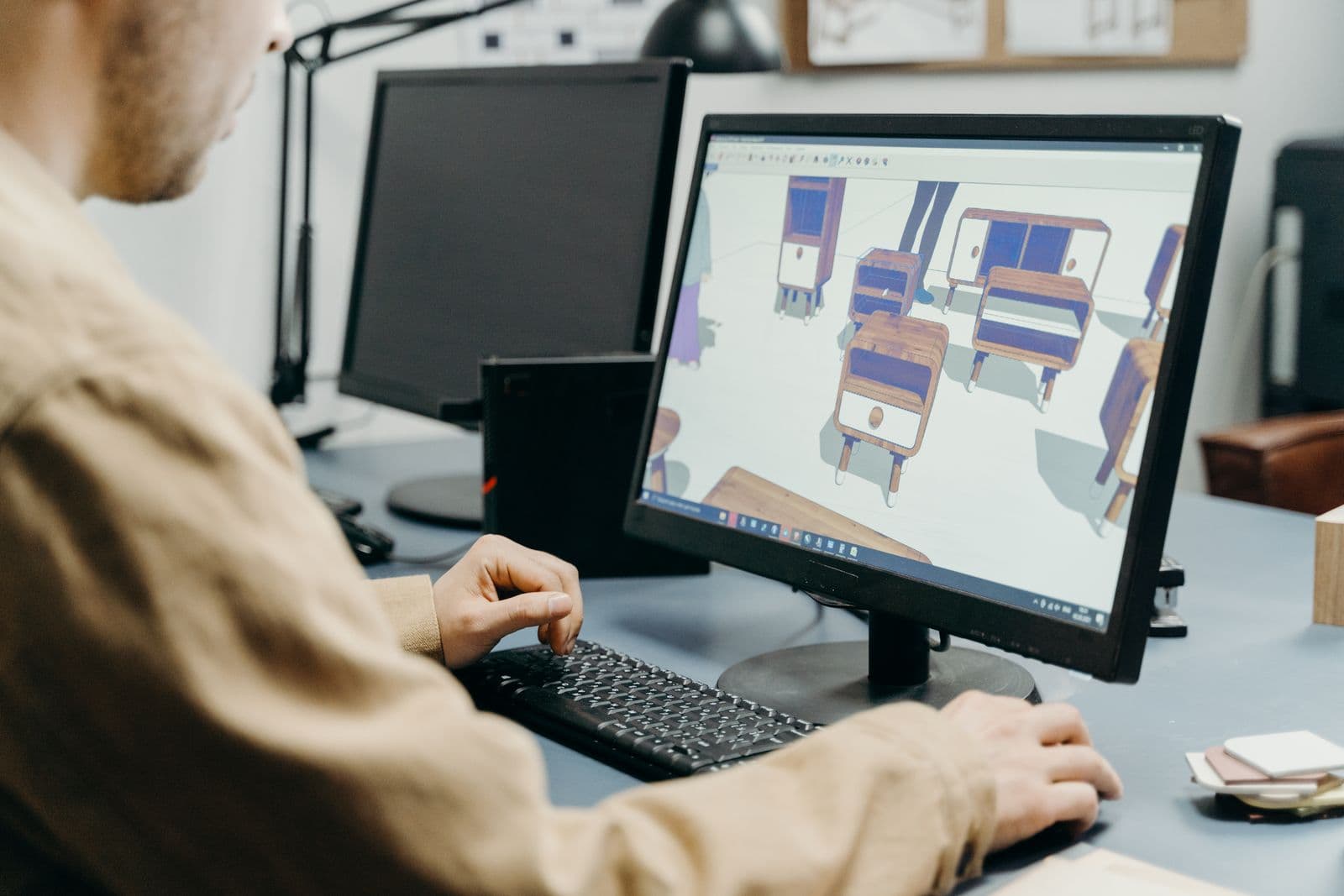 Designer working on a 3D structural model in CAD software